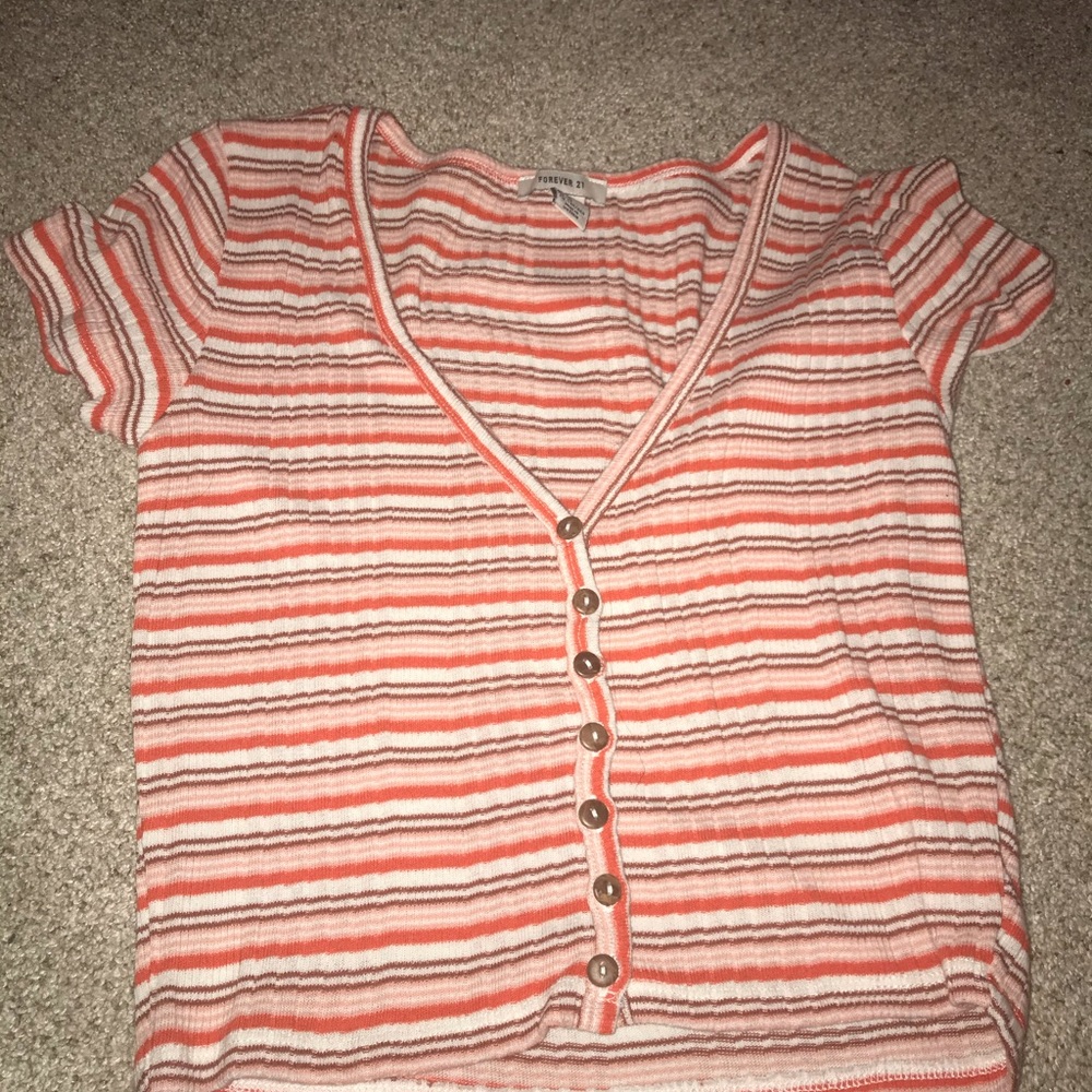 pink short sleeve v neck shirt